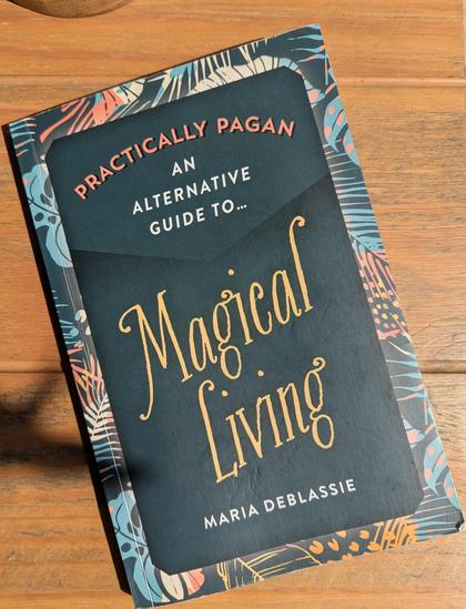 My battered copy of "practically pagan, an alternative guide to magical living" by Maria DeBlassie.