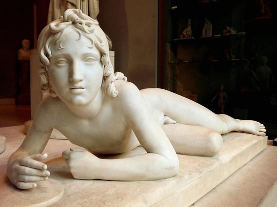 a photo facing the sculpture, the face looking directly at the viewer