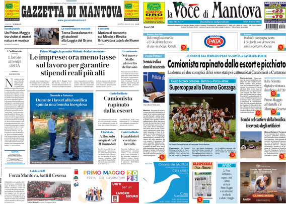 Due pagine di giornali affiancate su uno schermo. A sinistra, "Gazzetta di Mantova" con titoli come "Le imprese: ora meno tasse sul lavoro per garantire stipendi reali più alti" e "Camionista rapinato dalla escort". A destra, "La Voce di Mantova" con titoli simili, tra cui "Camionista rapinato dalla escort e picchiato" e "Supercoppa alla Dinamo Gonzaga". Entrambi i giornali presentano immagini e articoli su vari argomenti locali.