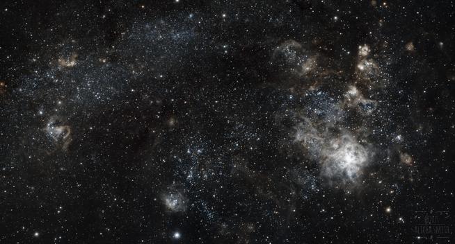 The Tarantula Nebula is on the right and on the left a spray of stars and small nebula.