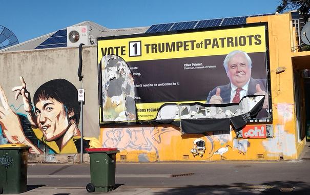 Clive Palmers fascist billboard sign in tatters with parts missing