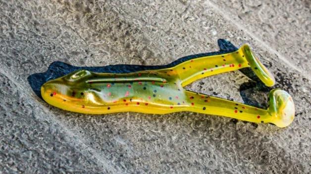 Green and yellow soft plastic fishing lure that looks like a frog.