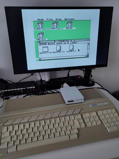 The STE is assembled again, and it's now running with the UltraSatan ACSI2SD card device just fine. Previously this combination was very prone to data trashing due to the DMA issue.