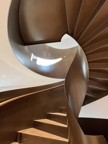 Curved spiral staircase as a special connection between the departments