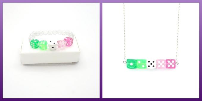 A two photo grid containing dice jewellery based on the abrosexual flag. The picture on the left is of a bracelet, which is finished with sparkly beads, and to the right is a necklace. The necklace is on a bar, and suspended from chain.