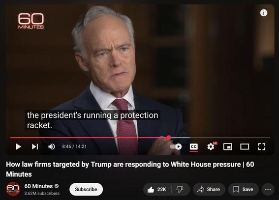 Still image from a video segment on the long-running news show 60 Minutes. It features an image of Scott Pelley, a 30+ year journalist, with a serious facial expression and closed caption below that says "the president's running a protection racket"

The title of the segment is at the bottom and it says "How law firms targeted by Trump are responding to White House pressure."