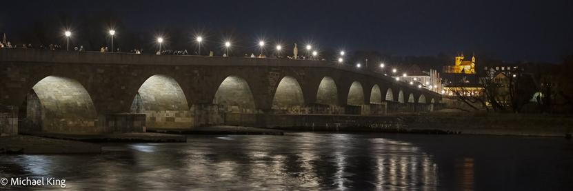 The arches of the stone bridge  in the early evening.