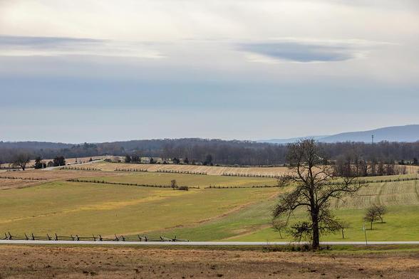 A serene landscape view of Gettysburg Battlefield from the Eternal Light Peace Memorial, capturing the essence of history and tranquility.