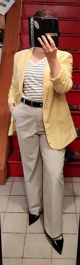 White T with skinny black stripes, white linen trousers, butter yellow cardigan. Black belt, black pointy toe slingbacks ( kitten heels). Minimal jewelry.
