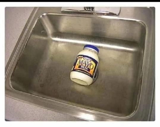 Visual pun: Photo of a large can of mayonnaise (the label clearly says "Kraft Mayo") sitting in a sink.