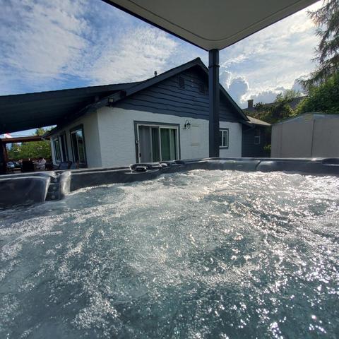 View from the hot tub of cottage & deck