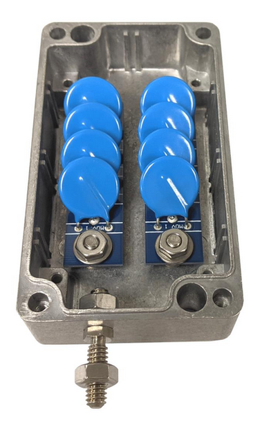 the inside of a surge suppressor.   Its in a metal box, and the side you can't see is basically terminal strips that come through to these capacitors that are on the inside.  There is a stud to tie the metal box to ground.