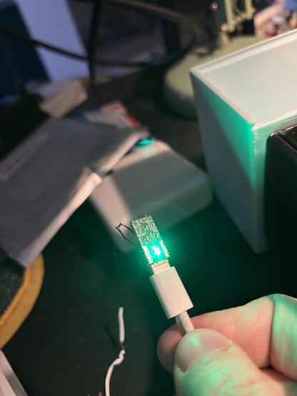 Proof that it worked. MacBook charger would not power before this “fix”. Green light glowing on the tiny PCB