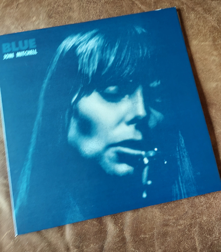 Jacket of the album "Blue" by Joni Mitchell, with a monochrome blue portrait of artist's face