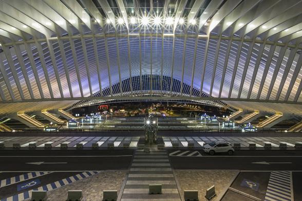 Night view on the train station by architect Santiago Calatrava, from a top view point. The shape and features of the building combined with a colourful lighting remind of a giant spaceship from a science fiction movie.