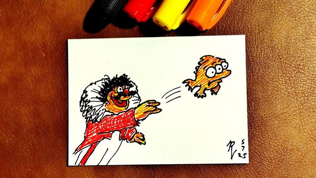 Marker drawing on an artist trading card of Lew Zealand throwing Blinky, the three-eyed fish from "The Simpsons." The drawing is signed with my "RV" signature glyph and dated 5-7-25. The black, red, yellow, and orange Sharpie markers used to draw the image rest on the table above the card.