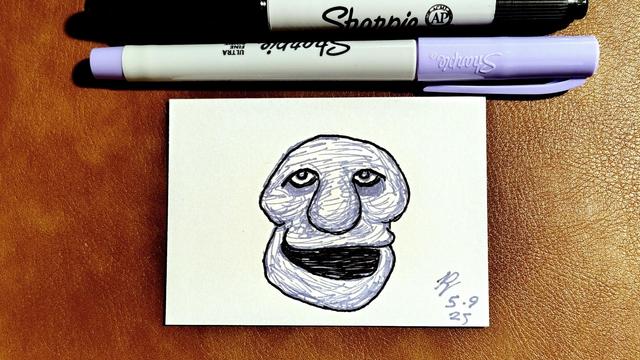 Marker drawing of a cartoonish purple slightly skull-like creature with heavy-lidded eyes and a big crooked smile. The drawing is signed with my "RV" signature glyph and dated 5-9-25. The double-tipped black and purple Sharpie markers used to draw the image rest on the table above the card.