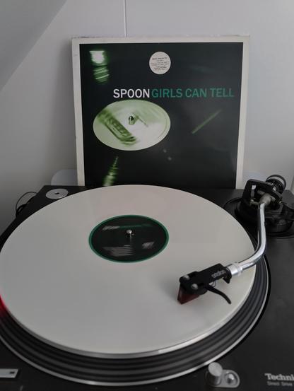 Photo of a turntable playing the album Girls Can't Tell by the band Spoon.