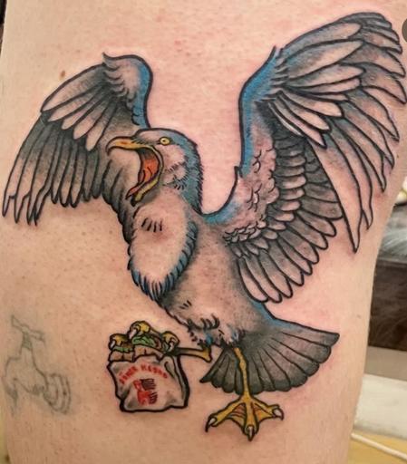 A seagull eating kebab tattoo