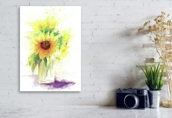 Sunflower stilllife with glass vase is a watercolor painting in vertical format painted by artist Karen Kaspar. It shows a stilllife with three beautiful sunflowers in a glass vase in vibrant shades of yellow, orange, green and purple.