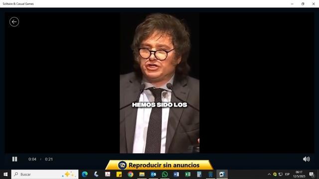 a picture of solitaire on Windows 11 playing a video add for fascist chud Javier Milei.