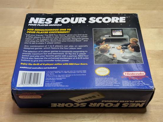 A photo of the back of the Four Score's box, which explains it can be used to play up to four player games on the NES by plugging in that many controllers at once.