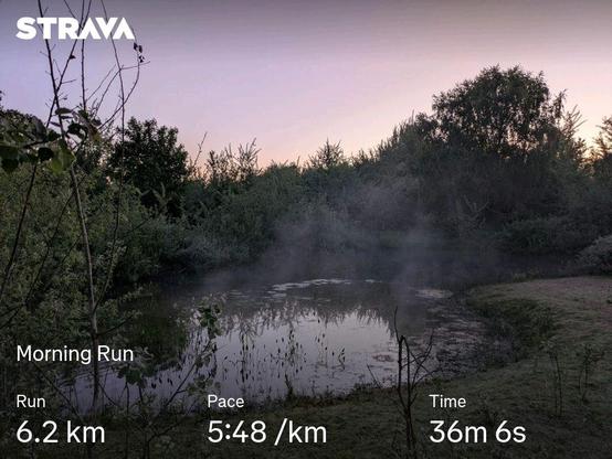 A pond at dawn, with running stats (6.2km 5:48/km 36m6s)