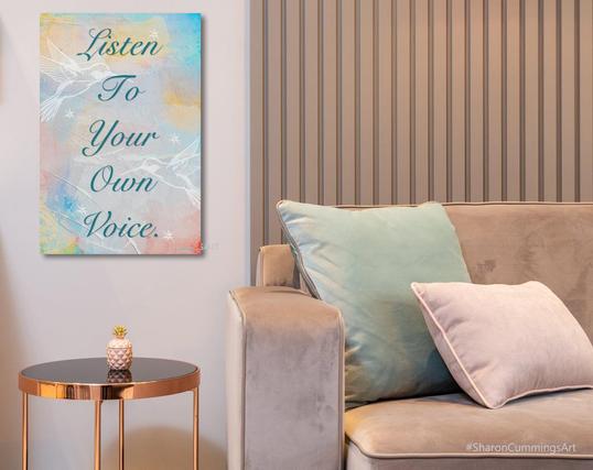 Art that says Listen To Your Own Voice on a light colorful background in a furniture setting by artist Sharon Cummings.