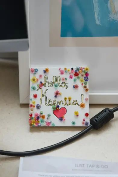 “Any problem I have with data, she has a solution,” a colleague said. A photograph taken from her desk at Harvard showing a cheerful hand-drawn note that says "hello, Kseniia!" decorated with a heart and lots of tiny colorful flowers