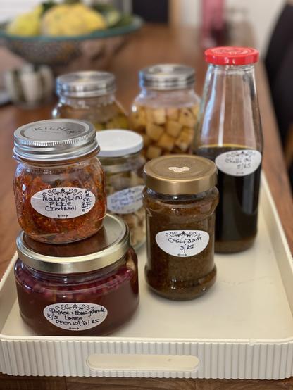 Jars and bottles of products as described.