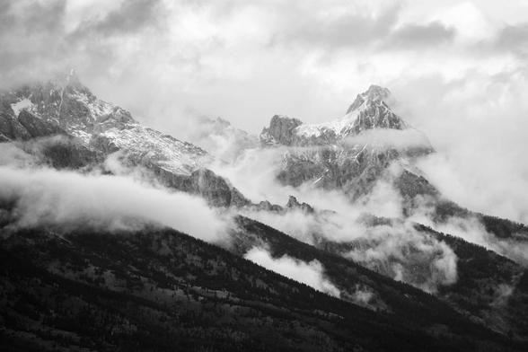 The Teton Range covered in clouds after a storm.