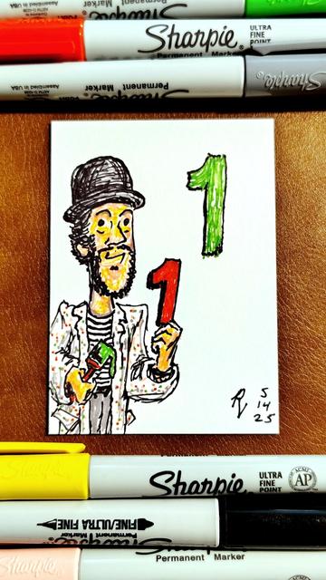 Marker drawing of "Sesame Street's" Mad Painter character, as played by Paul Benedict. He smiles and holds a red number 1 up to the matching green number 1 he has just painted on the wall behind him, as green paint drips from the paintbrush in his other hand. The drawing is signed with my "RV" signature glyph and dated 5-14-25. The green, red, grey, yellow, black, and pink markers used to draw the image rest on the table above and below the card.