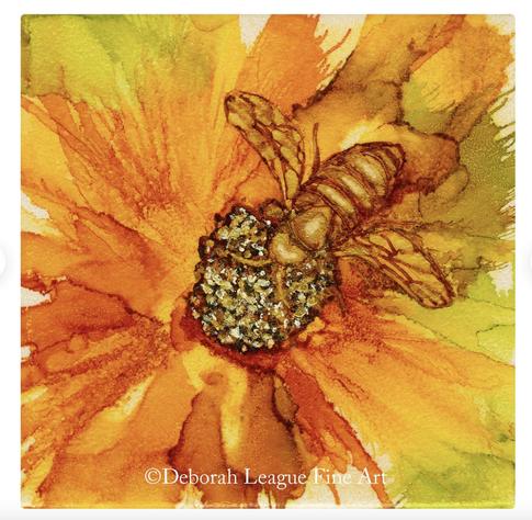 In Bee on Orange Flower alcohol ink painting, a golden bee collects pollen from the plumply mounded center of a bright orange flower in the garden. Rich, saturated colors of orange, gold and green dominate. The blown flowers abstractly depict the naturalness of this scene.