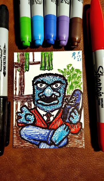Marker drawing of the Beautiful Day Monster, a particularly scary-looking Muppet monster who appeared in bit parts on "The Muppet Show" as well as "Sesame Street." As a pun on his name, I've drawn him dressed as Mr. Rogers as he appeared in every "Mister Rogers' Neighborhood" episode opening, sitting on his bench and changing his shoes while singing "It's a Beautiful Day in the Neighborhood." The drawing is signed with my "RV" signature glyph and dated 5-17-25. The black, green, light and dark blue, purple, brown, and red markers used to draw the image rest on the table surrounding the card.