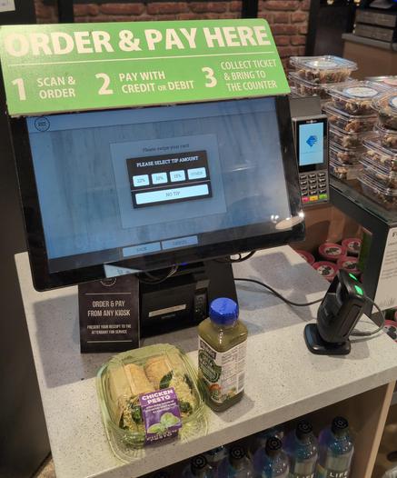 A self-checkout kiosk screen asking if I want to leave a tip.
