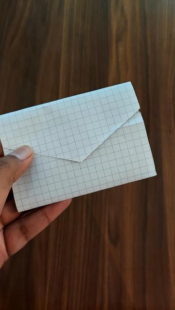 Pattern of mini wallet out of paper, in the form of an envelope