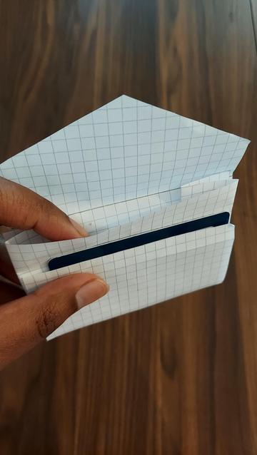 Pattern of mini wallet out of paper, open, fitting one plastic card