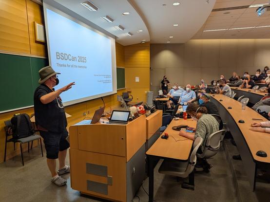 Large classroom of attendees with Michael W Lucas leading the session.