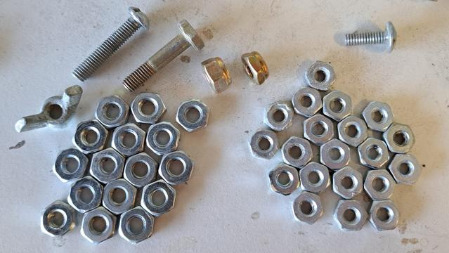 A collection of mostly hardware store nuts (silver colored), and a few aviation nuts and bolts (gold colored).

Choose your connectors carefully, especially if they are used in critical components.