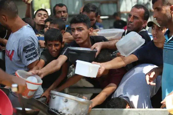 Charity organisations distribute food to Palestinians at Nusierat Refugee Camp in Gaza City [Hassan Jedi/Anadolu]

   Our WFP teams in Gaza are doing heroic work under conditions that are simply impossible. They are frequently caught in crossfire, they are stuck in steaming hot cars for 24 hours straight, escorting food convoys through combat zones. We don’t have enough fuel for our vehicles, or spare parts for our trucks or cars, or basic equipment to communicate.
    A ceasefire is urgently needed … During the previous ceasefire, we showed what was possible: delivering more than 8,000 trucks of food in only 42 days. We can do it again, but we need all routes and entry points to open, and we need safety in order to be able to reach the most vulnerable.