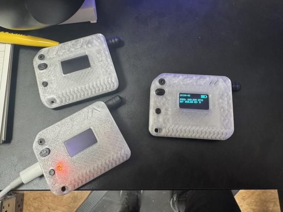 Three Heltec v3 lora devices in translucent 3d printed cases