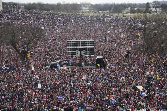 Supporters listen as President Trump speaks during a Save America Rally
