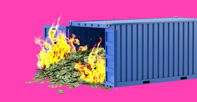 Pile of money on fire pouring out of a shipping container.