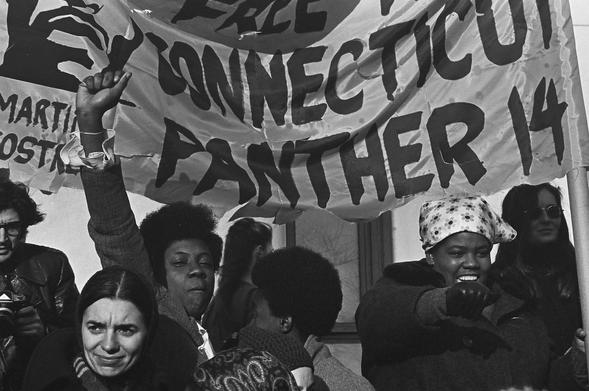Protestors rally in support of the Connecticut Black Panthers and activist Martin Ramirez Sostre in New Haven, Connecticut , on May 1970. A banner reads "Free The Connecticut Panther 14."