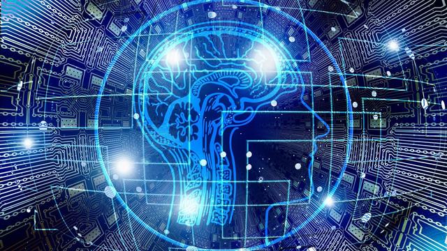 An illustration of a brain against a computer circuit board. | Copyright Geralt via Pixabay