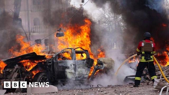 Firefighters extinguish fires in cars fires following a Russian missile attack on Sumy, Ukraine on April 13, 2025.