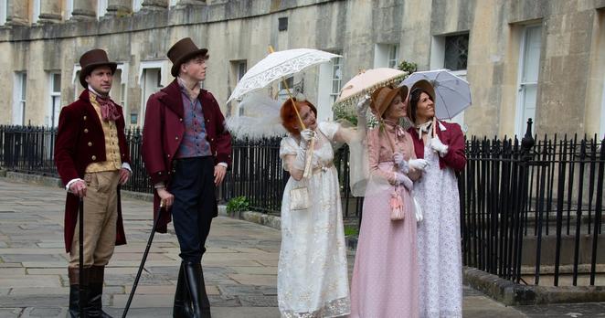 Strictly Jane Austen walking tour group navigating the cobbled streets of Bath