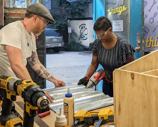 Devon Curtin helps teach a little free library workshop at PVD Things in 2024.