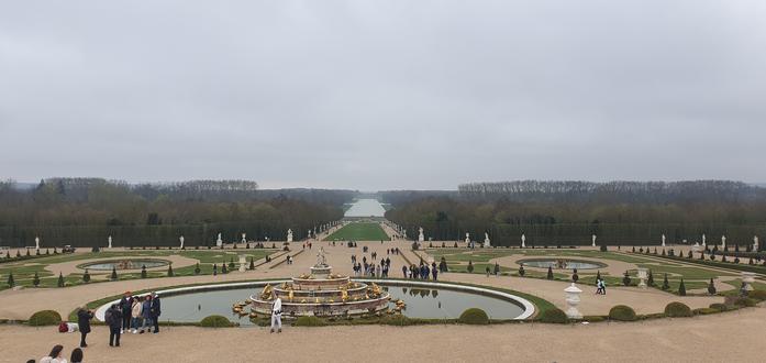 View of the gardens of Versailles on a cloudy day. View of the gardens of Versailles on a cloudy day.