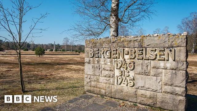 A wall inscribed with the words Bergen-Belsen 1940-1945 stands at the site of the former concentration camp
